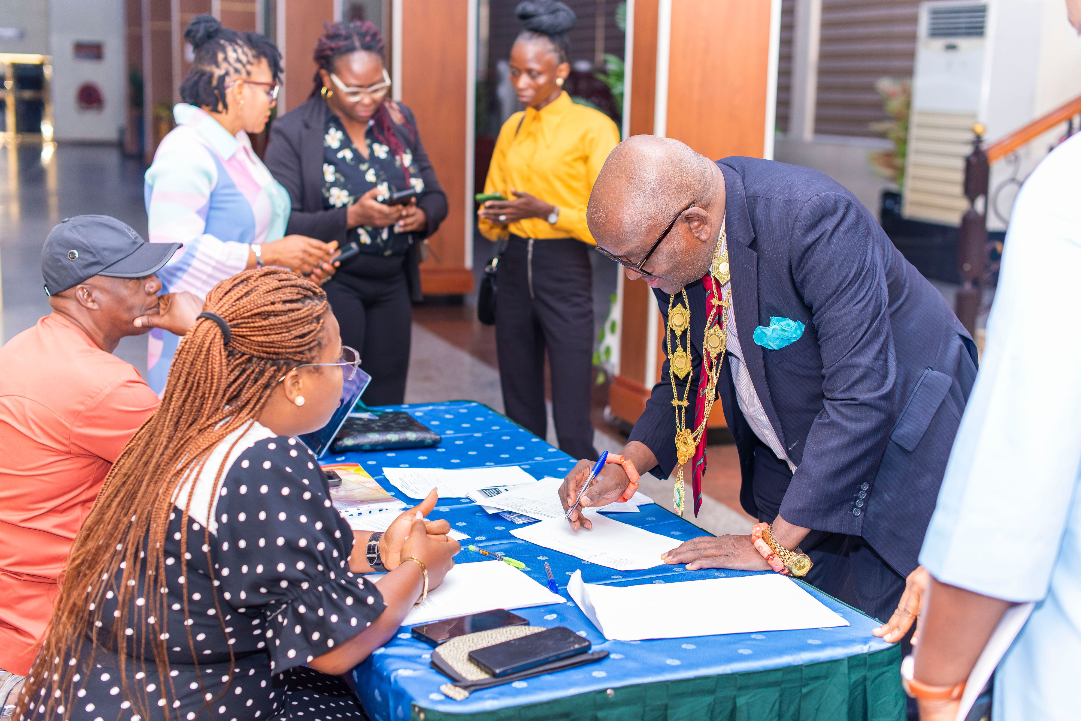 Attendees at the 2025 ADLM GLQI Nigeria workshop filling out forms