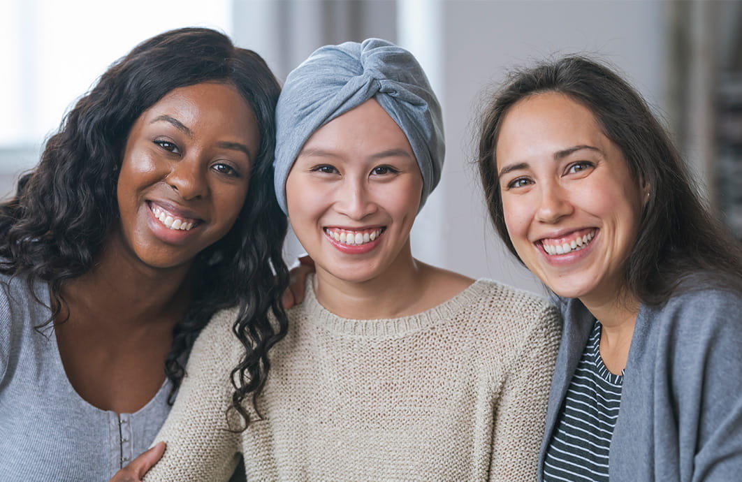 Three smiling women posed for a picture