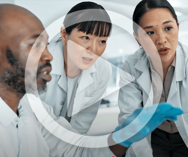 Still image of three laboratory scientists with a play button superimposed