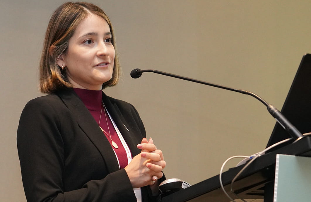 Woman speaking at lecturn