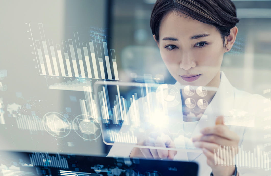 Female lab technician looking at holographic screen