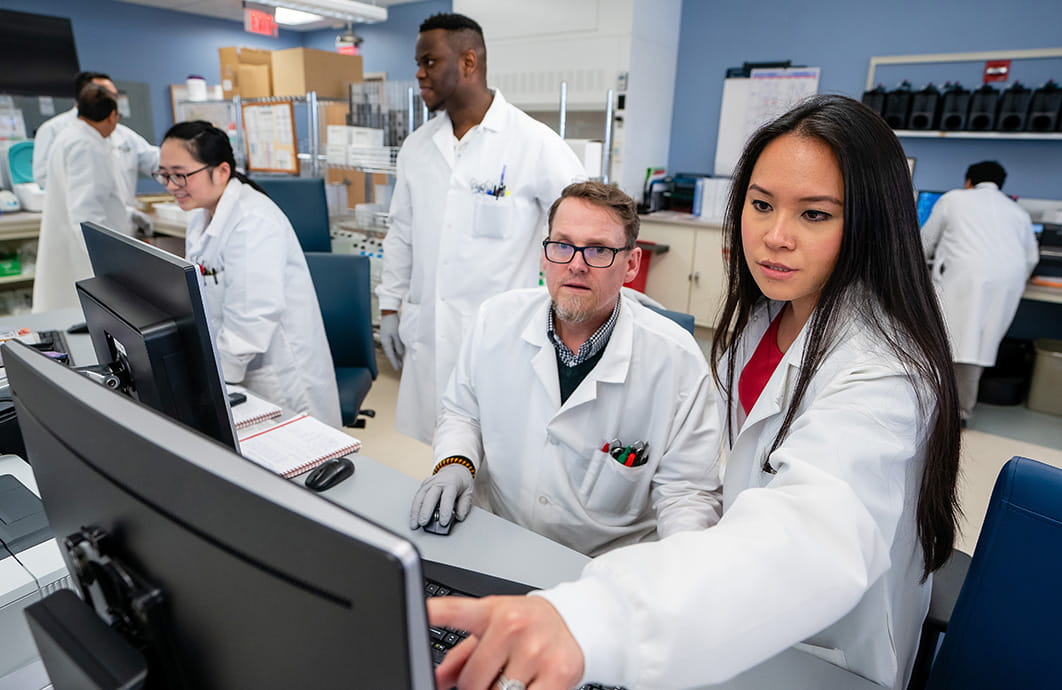 Laboratorians working in the lab.