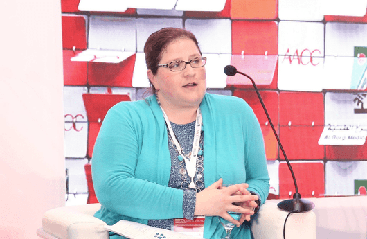 Jeanne Mumford speaking at a conference